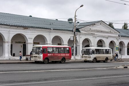 Russia, Golden Ring, Kostroma, Susanin Square: Street scene with two public buses in front of the famous  Central Market (Tsentral'nyy Rynok) in the city center of the Russian town. Jul 05, 2019のeditorial素材