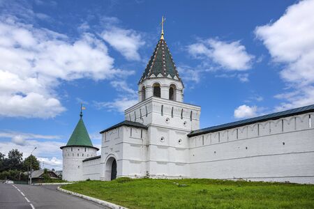 Russia, Golden Ring, Kostroma: Main entrance gate to the famous onion domed Ipatievsky Monastery opposite the city center of the Russian town with historic white wall, road and blue sky - architectureのeditorial素材