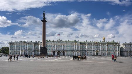 Russia, Saint Petersburg, near Neva river, Palace Square: People tourists in front of famous Winter Palace in the city center of the Russian town with Alexander Column, blue sky - travel. Jul 08, 2019のeditorial素材