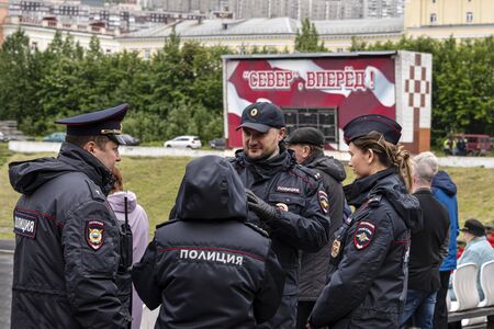 Russia, Arctic, Barents Sea, Murmansk: Group of young policemen women and men in football stadium of FC Sever Murmansk (North Forward!) in the city center of the northern Russian town. Jul 14, 2019のeditorial素材