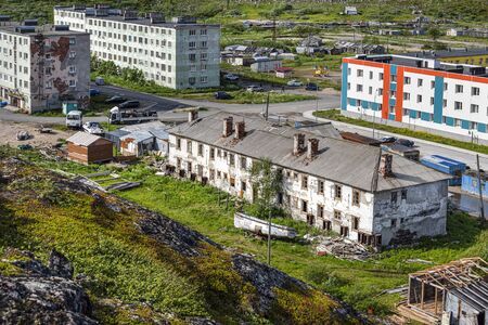 Russia, Arctic, Kola Peninsula, Barents Sea, Teriberka: Aerial view of Lodeiny, the newer part of the old Russian settlement small fishing village with run down apartment buildings. Jul 19, 2019のeditorial素材