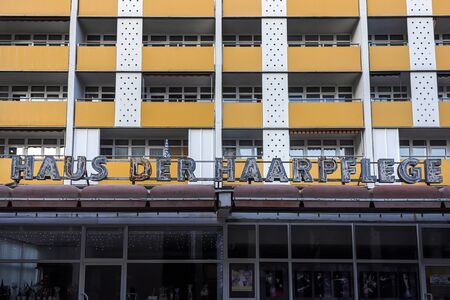 Germany, Saxony-Anhalt, Dessau-Rosslau, Ratsgasse: Historic old neon sign Haus der Haarpflege (House of Hair Care) on house front facade in the city center of the German town - marketing. Dec 29, 2019のeditorial素材
