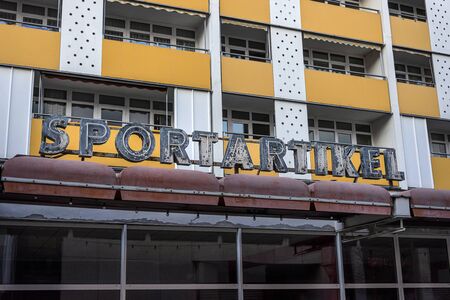 Germany, Saxony-Anhalt, Dessau-Rosslau, Ratsgasse: Historic old neon sign Sportartikel (Sporting Goods) on house front facade in the city center of the German town - marketing design. Dec 29, 2019のeditorial素材