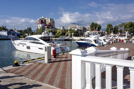 Russia, Black Sea, Sochi: Panorama view of famous yacht harbor marina port in the city center of the famous Russian town with boats, ocean water, quay, modern skyline - travel vacation. Jun 26, 2020のeditorial素材