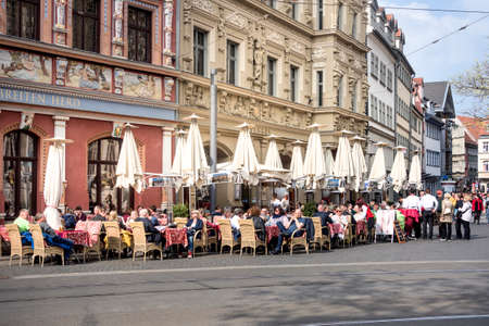 Germany, Erfurt, Fischmarkt - May 06: People on outside terrace of a restaurant near Town Hall, 06 May 2017のeditorial素材