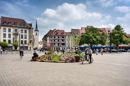 Germany, Thuringia, Erfurt, near Dome - May 07: Cathedral square with people, buildings and church in the background, 07 May 2017のeditorial素材