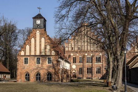 Germany, Brandenburg, Jueterbog - February, 2017: Front view and park of Zinna Abbey church (Kloster Zinna). The abbey is a former Cistercian monastery, about 60 km (37 miles) south of Berlin.の写真素材