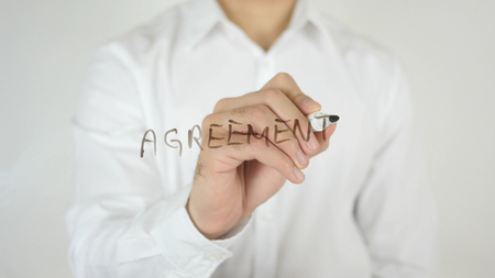 Agreement, Written on Glass by Man in Studioの写真素材