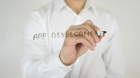App Development, Written on Glass by Man in Studioの写真素材