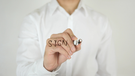 Sign Up, Written on Glass by Man in Studioの写真素材