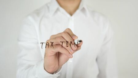 Tax Time, Written on Glass by Man in Studioの写真素材