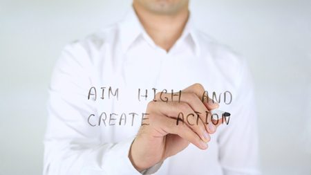Aim high and Create Action, Man Writing on Glass, Handwrittenの写真素材