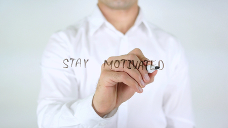 Stay Motivated, Man Writing on Glassの写真素材
