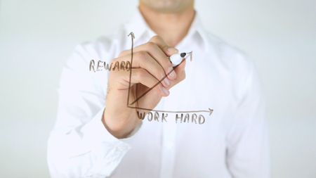 Reward - Work Hard Graph, Man Writing on Glassの写真素材