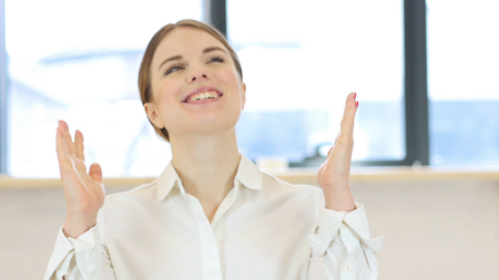 Success, Celebrating Excited Woman in Office at Workの写真素材