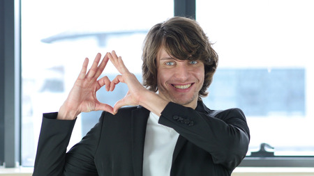 Heart Sign by Man in Love, Indoorの写真素材