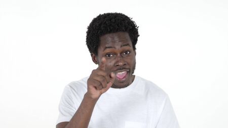 Casual African Man Pointing at Camera Isolated on White Backgroundの写真素材