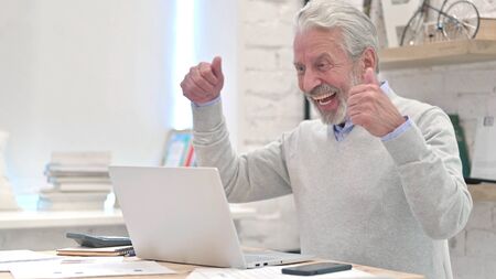 Senior Old Man Celebrating Success of Projectの写真素材