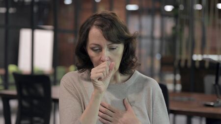 Sick Old Woman having Coughing at Cameraの写真素材