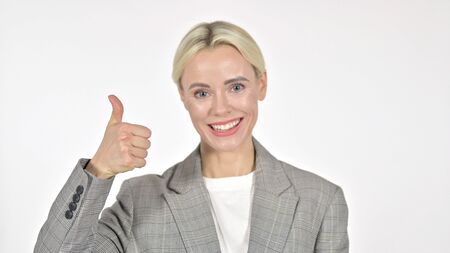 Businesswoman Gesturing Thumbs Up on White Backgroundの写真素材