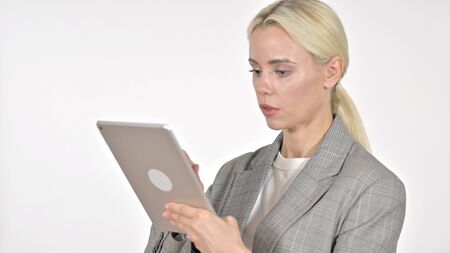 Businesswoman Browsing Internet on Tablet, White Backgroundの写真素材