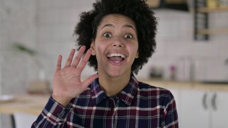 The Portrait of African American Woman Waving at Camera