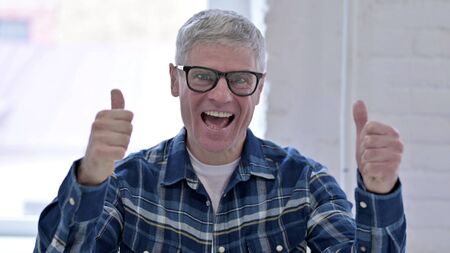 Portrait of Ambitious Casual Middle Aged Man Celebrating Success