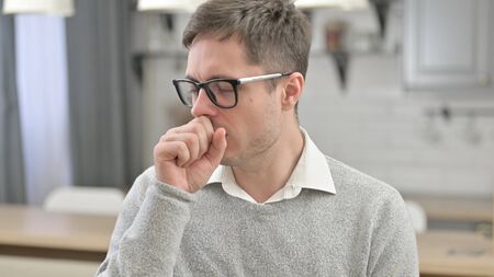 Portrait of Sick Young Man Coughing