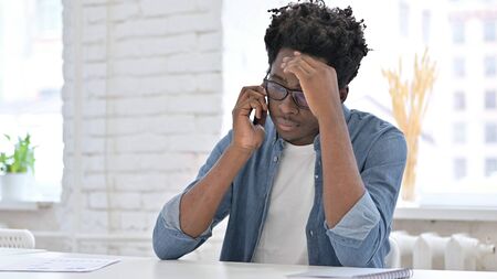 Argument on Phone Talk by Upset African Manの写真素材