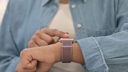 Close Up of African Woman Using Smartwatch