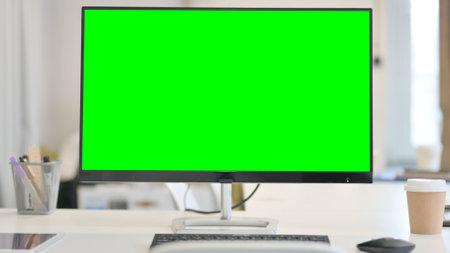 Close up of Desktop with Green Chroma Key Screenの写真素材