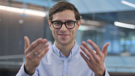 Portrait of Young Man Pointing at Camera, Inviting