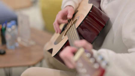 Close up of Man Playing Guitar
