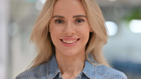 Close Up, Cheerful Young Woman Smiling at Camera