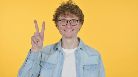 Victory Sign by Redhead Man, Yellow Background