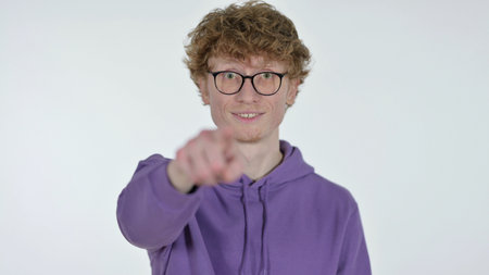 Redhead Man Pointing and Inviting, White Backgroundの写真素材