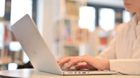 Female Hands Typing on Laptop Keyboard, Close upの写真素材