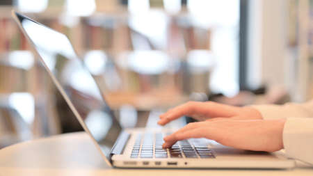 Female Hands Typing on Laptop Keyboard, Close upの写真素材