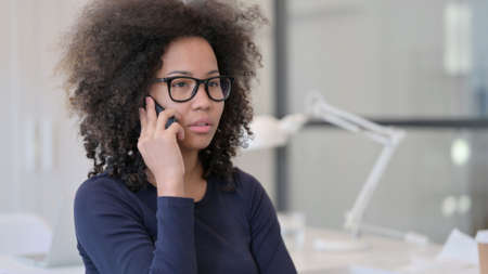 African Woman Talking on Phoneの写真素材