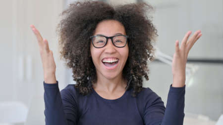 Happy African Woman Excited by Success
