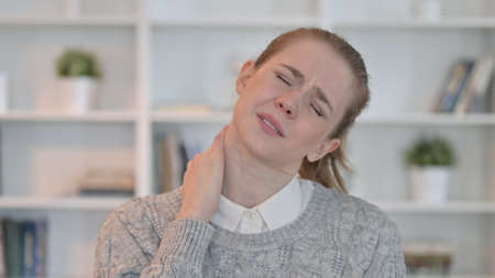 Tired Woman having Neck Painの写真素材