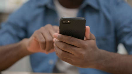Close up of African Man Using Smartphoneの写真素材
