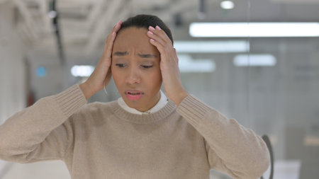 African Businesswoman Reacting to Loss, Failure