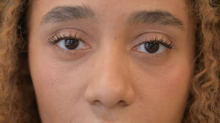 Close up of Blinking Eyes of Beautiful African Womanの写真素材