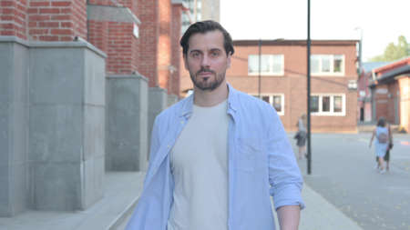 Portrait Shot of Man Walking on the Street