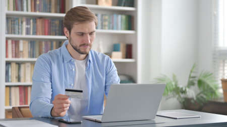 Online Payment on Laptop by Man at Work