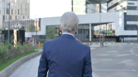 Back View of Walking Old Businessmanの写真素材