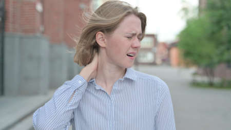 Portrait of Woman having Neck Pain, Outdoor