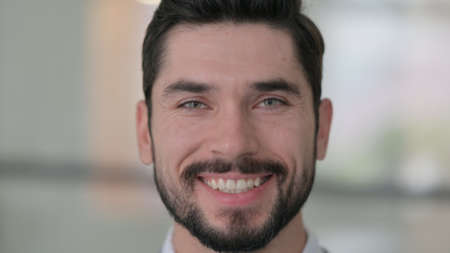 Close up of Young Man Smiling at the Camera