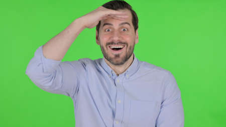 Portrait of Man Looking Around, Searching, Green Screenの写真素材